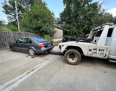 Junk Car being towed away by Express Cash For Junk Cars Charlotte team. Turn your old, unwanted vehicle into cash with our quick and hassle-free process. Contact us at 704-953-5867 and say goodbye to your junk car today!